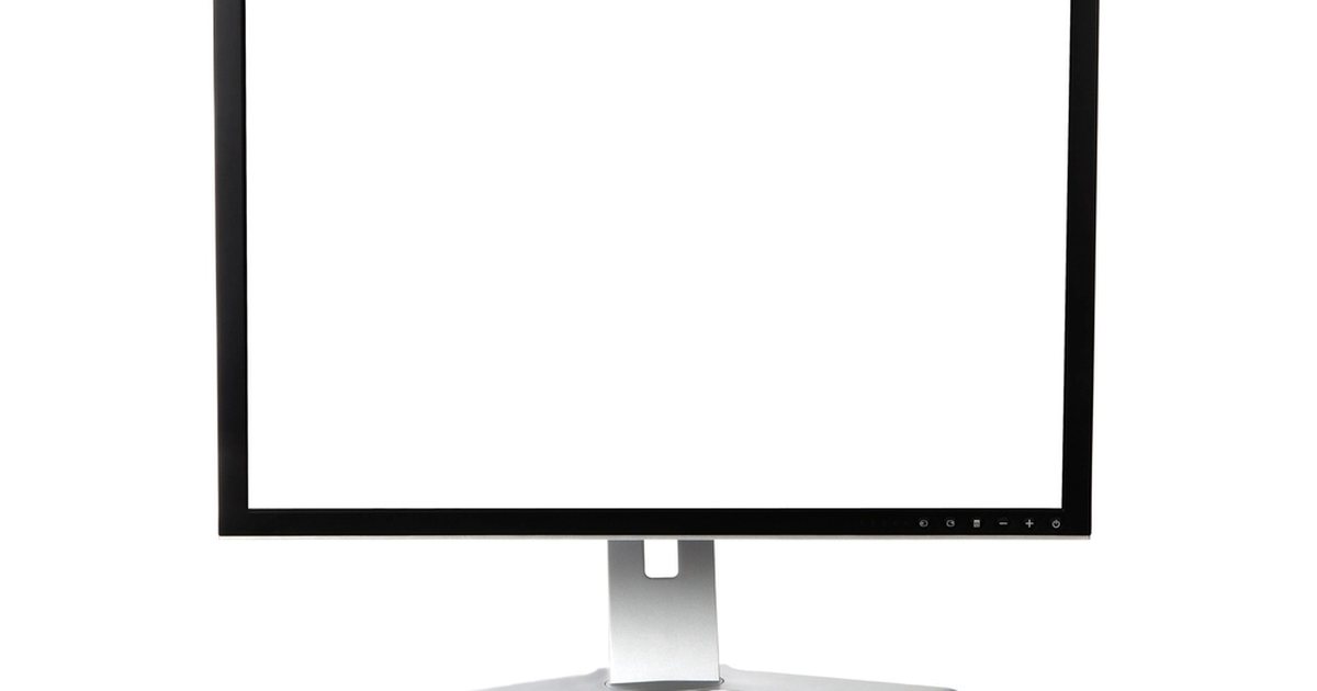 Monitor de ordenador con la pantalla en blanco sobre un escritorio